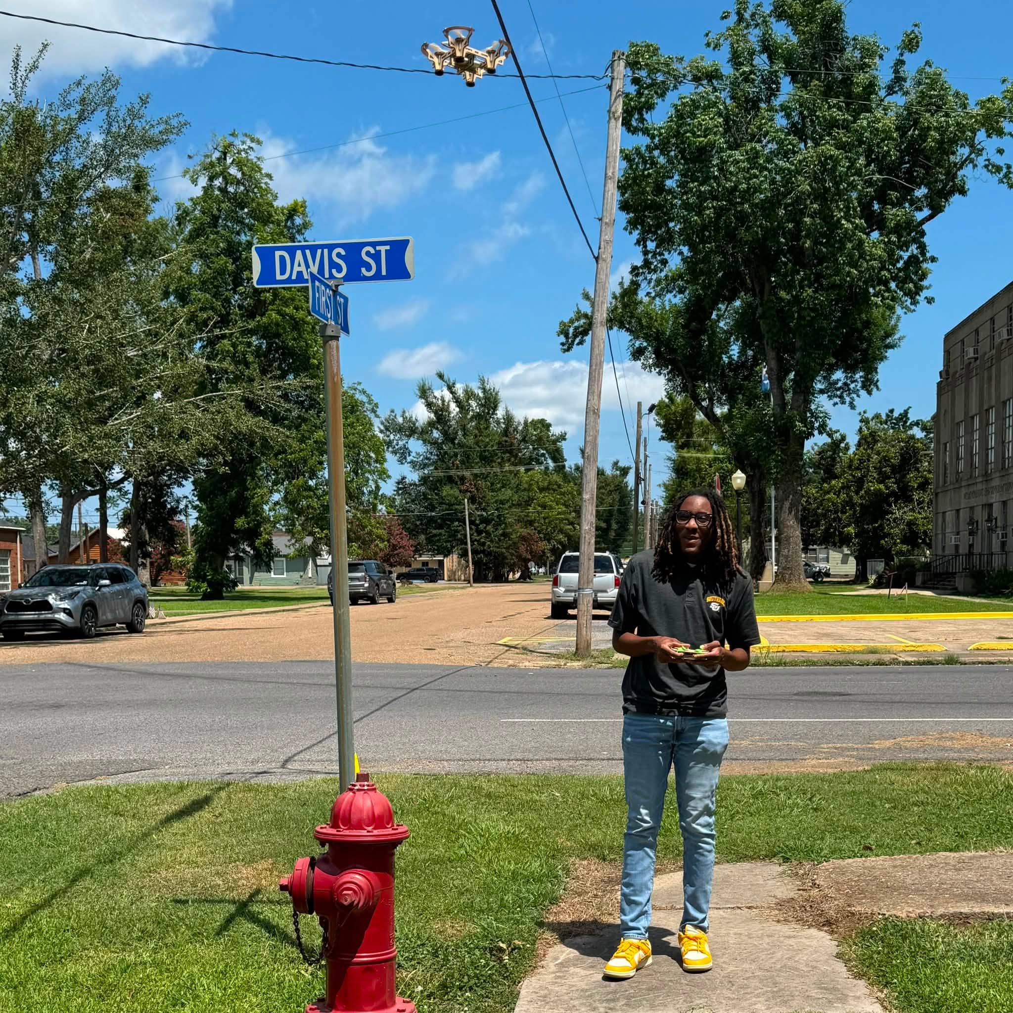 A man flying a small drone.